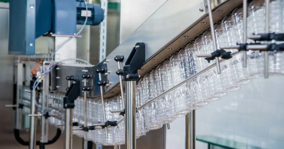 Empty plastic bottles on conveyor system