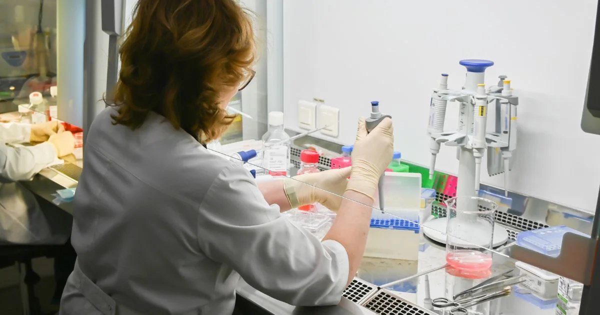 Scientist working at pharmaceutical workstation