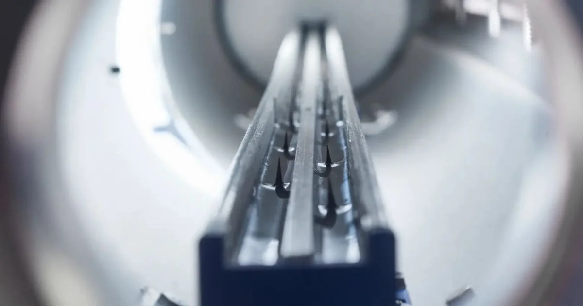 Static control bar installed inside industrial manufacturing equipment.