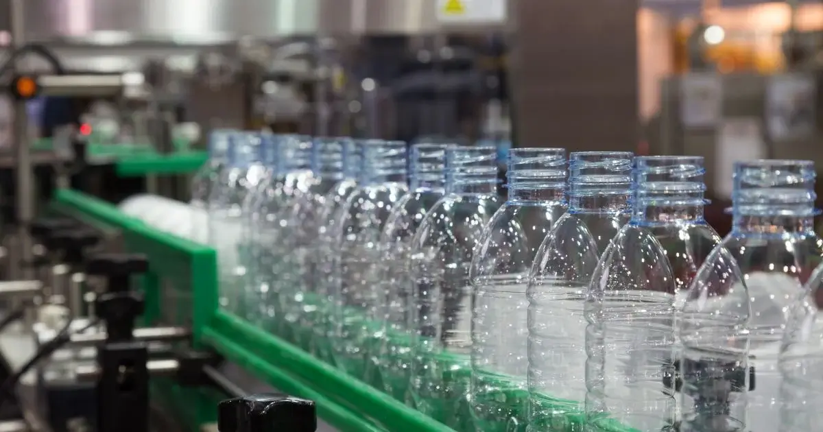 Plastic bottles moving through production line