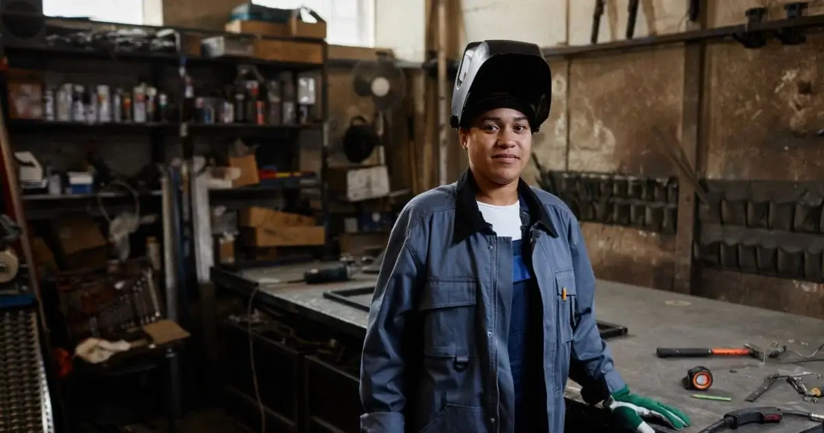 Worker at industrial downdraft table in workshop